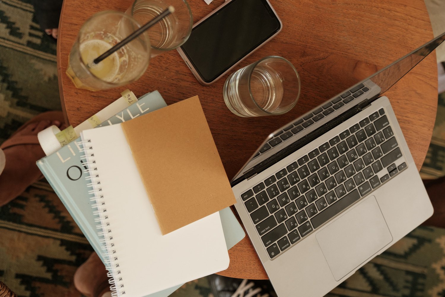 Laptop, Notebook and Drinks on Table